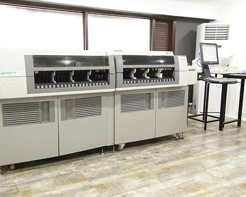 A laboratory bench with a scientific instrument and a computer.